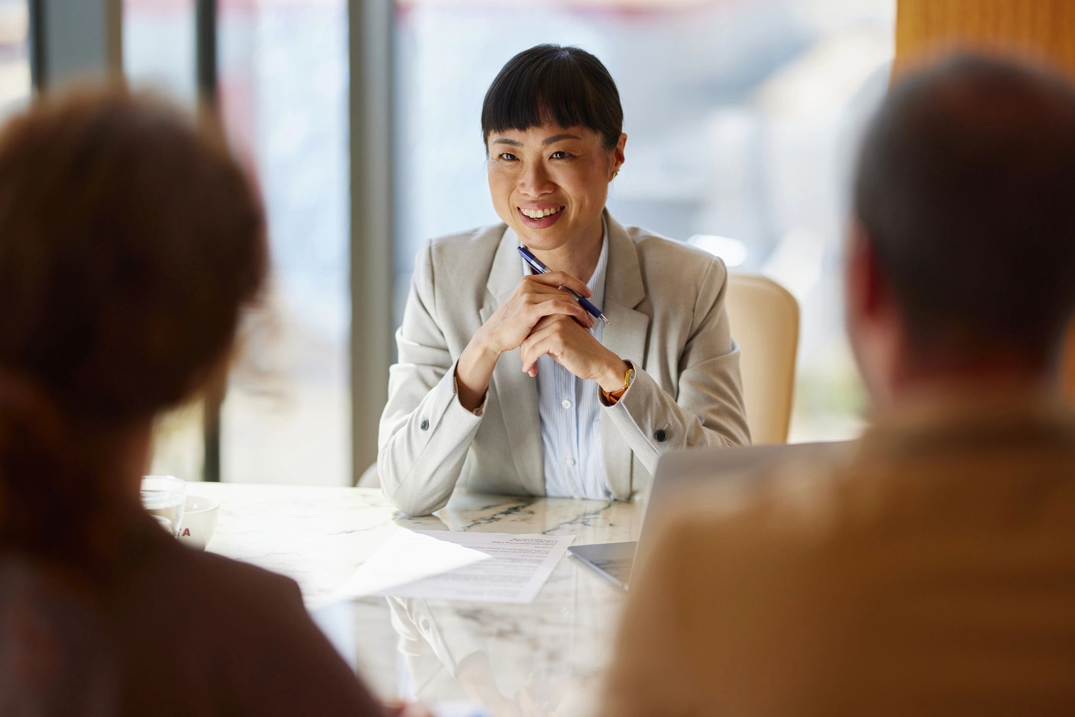 Commercial real estate advisor meeting with clients in an office